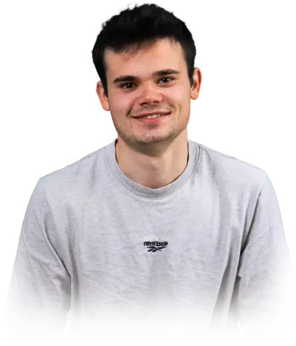 Web Developer, Ben Sandison smiling in a gray shirt
